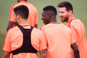 Lionel Messi y Ousmane Dembele  